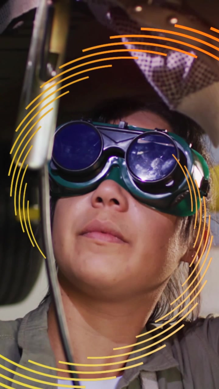 Animation of yellow to orange pattern moving over female welder