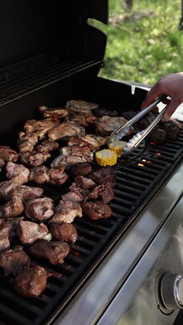 grilled meat and corn on a barbecue