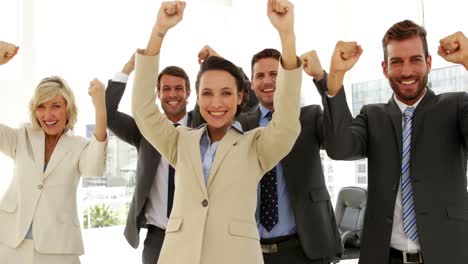 business people cheering at the camera