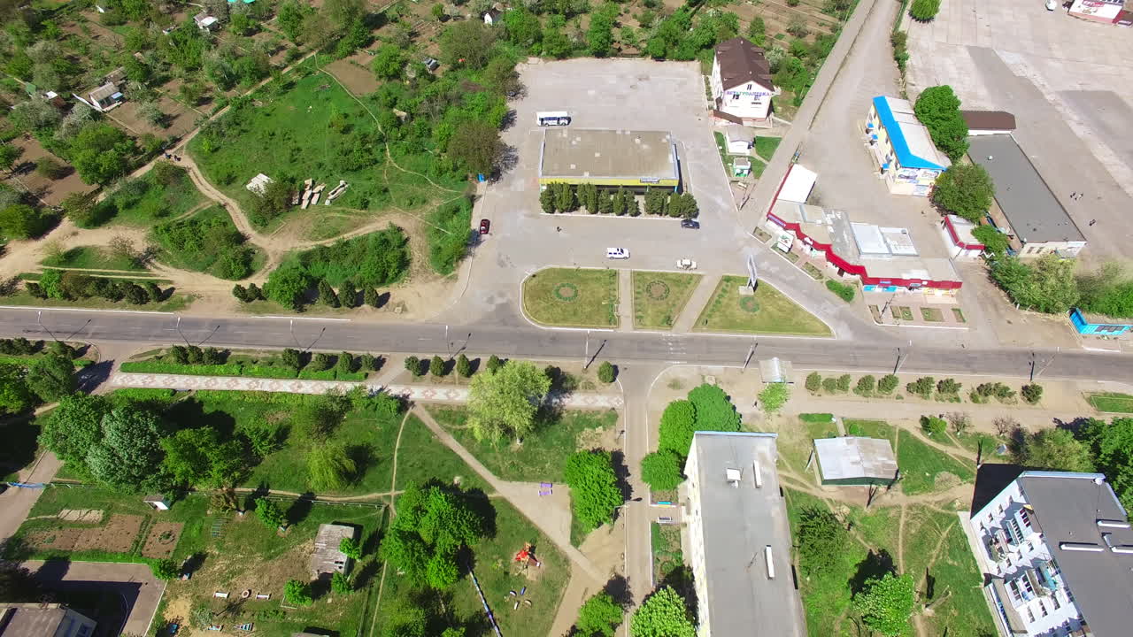 Green territory in the town near rural countryside. Beautiful daytime footage from aerial perspective.