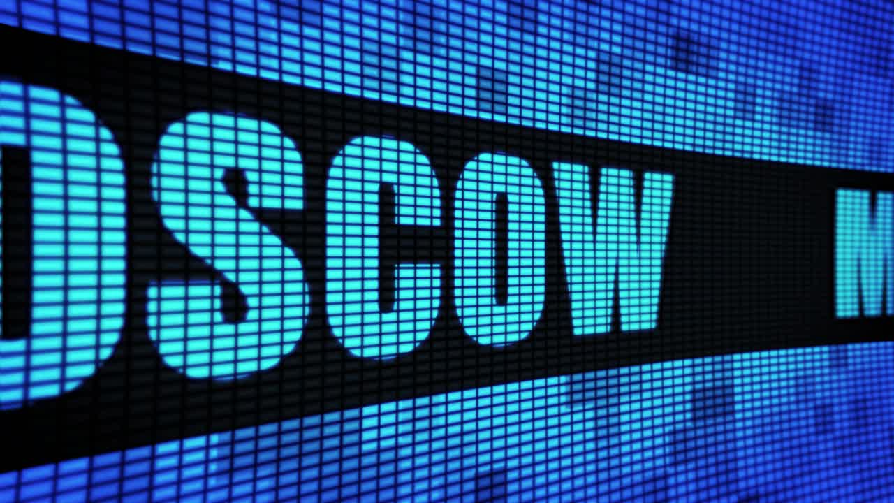 Scrolling text on a digital display showing "Moscow" and "Scow".