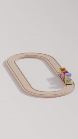 colorido tren de juguete de madera en la vía