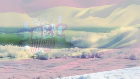 digital composition of waving spain flag against waves in the sea