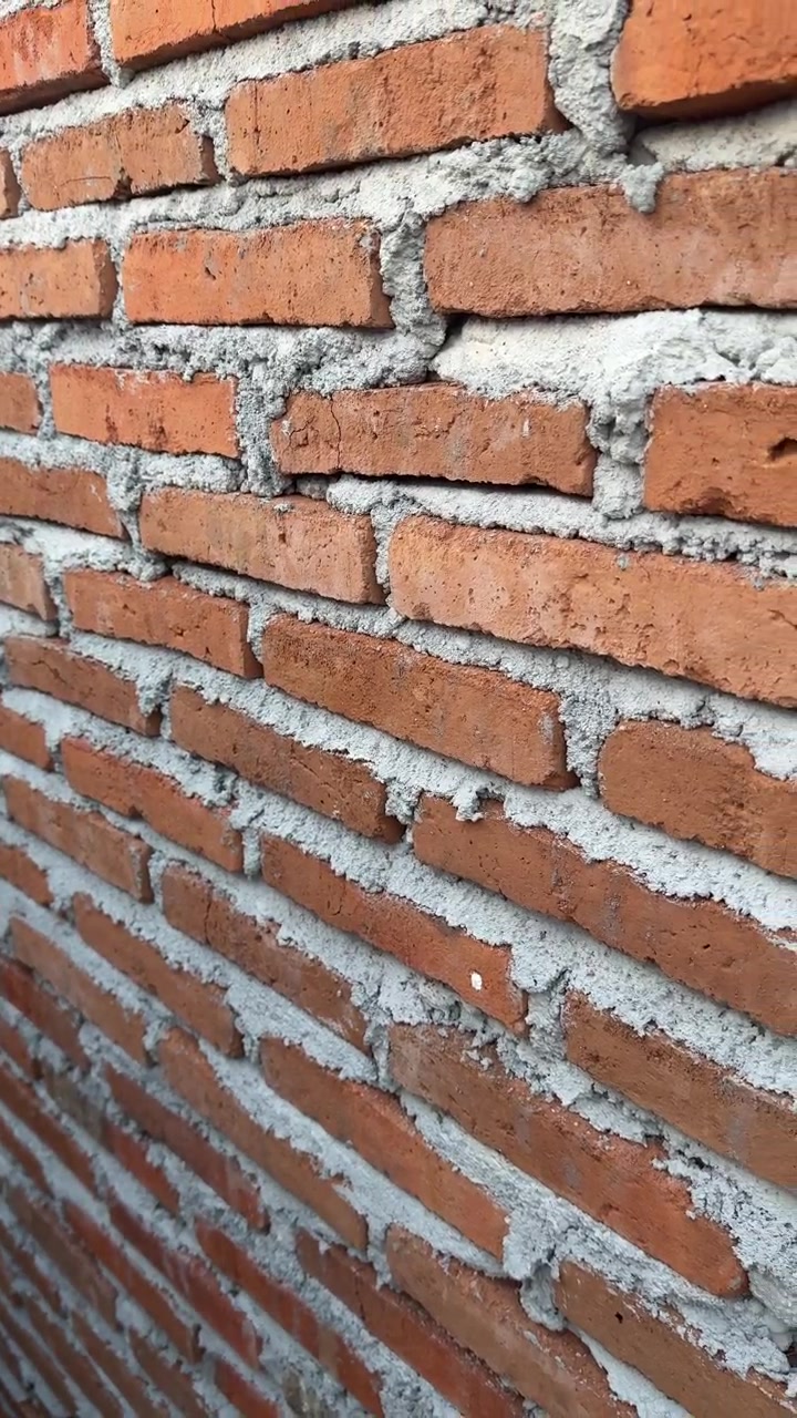 Close-up View of a Red Brick Wall Construction