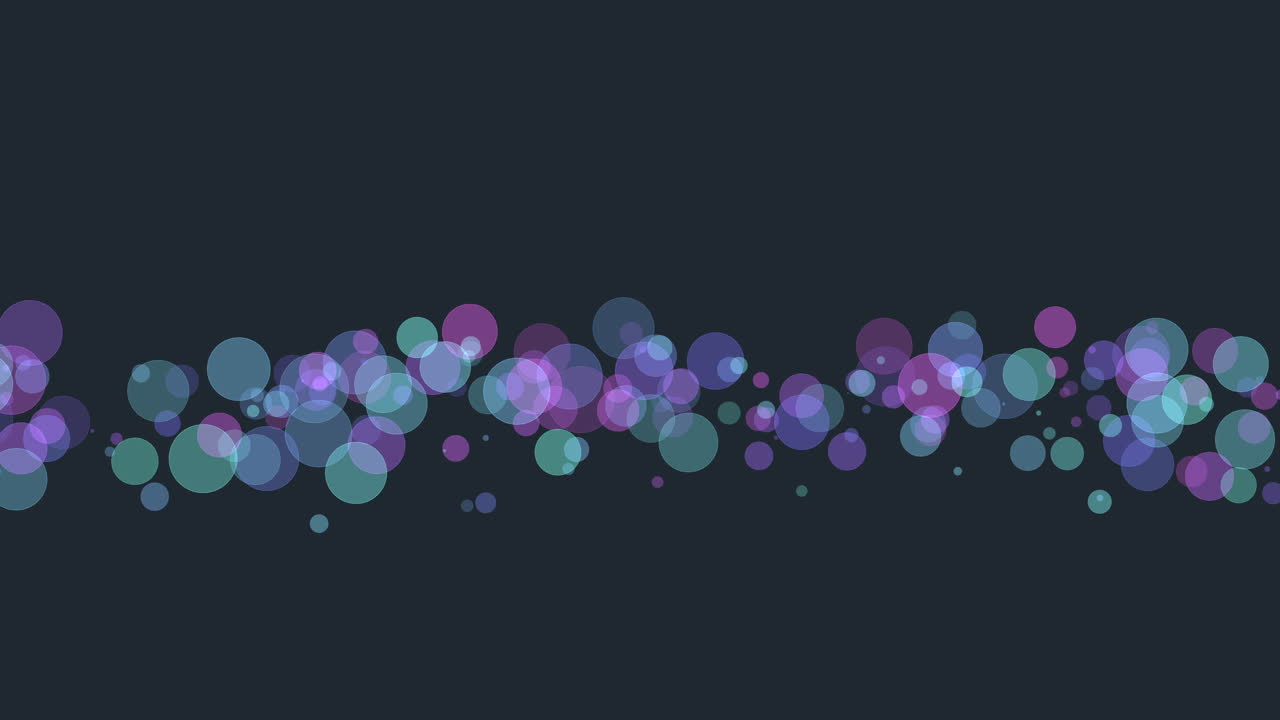 círculos púrpuras y azules brillantes suspendidos en el aire sobre un fondo negro