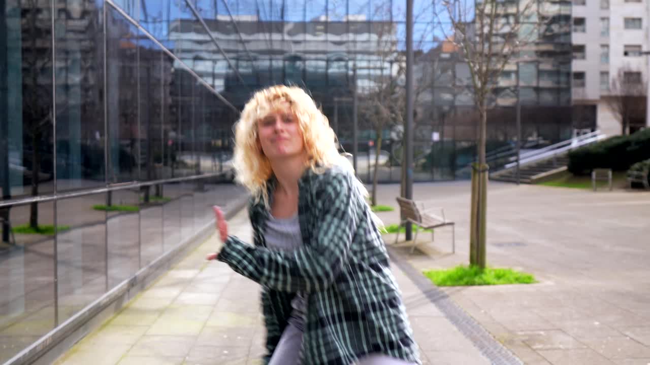 Woman dancing on a city street