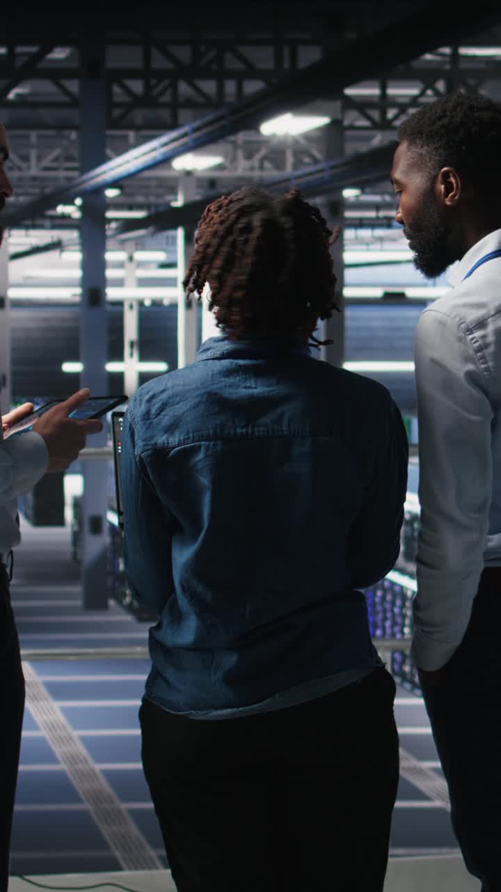 Vertical video Software developers in data center monitoring AI LLM visualization