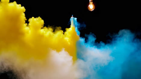 abstract smoke art with spray paint and lightbulb