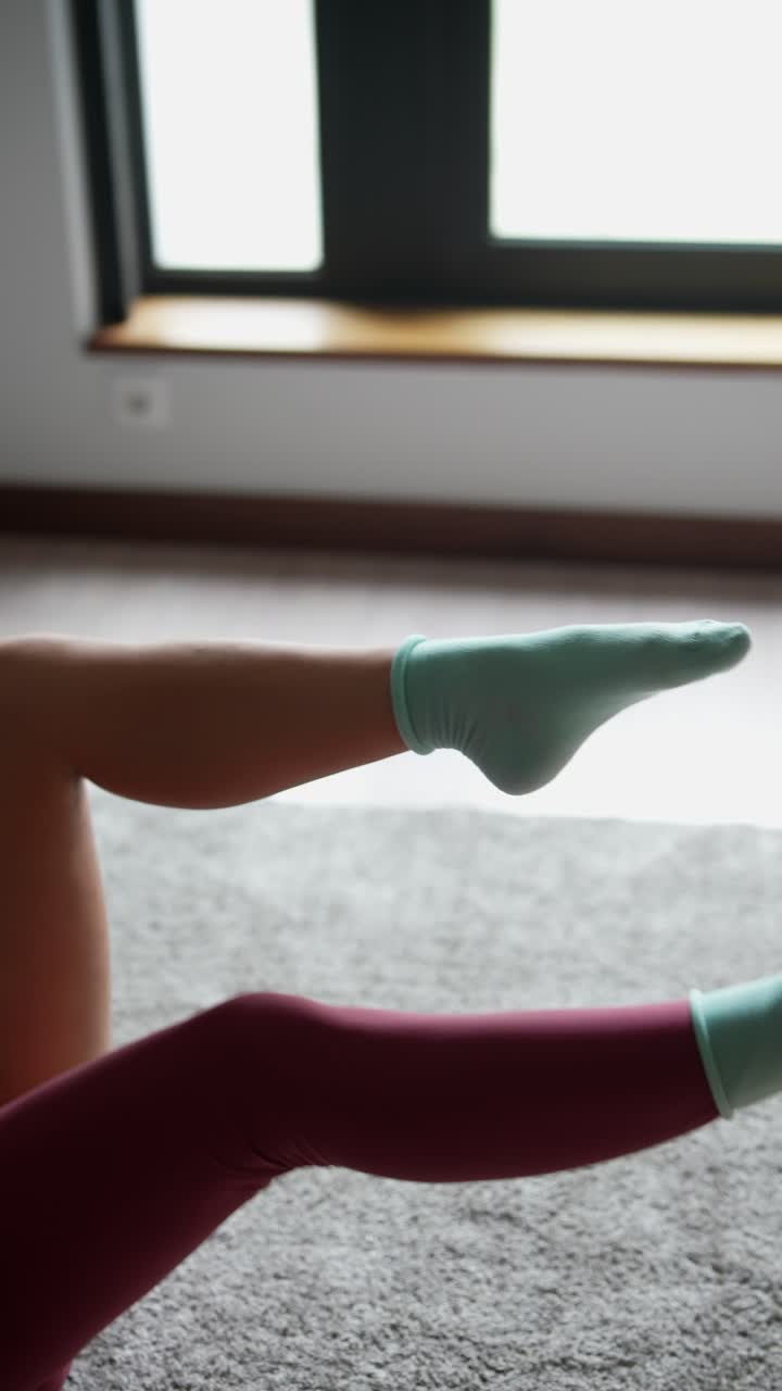 Woman doing leg exercises at home