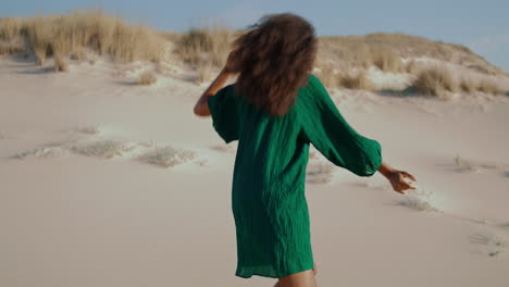 sensual dancer performing desert in black dress. girl dancing emotionally.