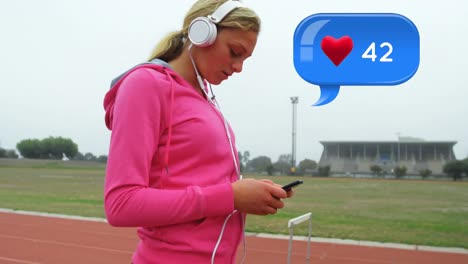 Woman-wearing-headphones-while-texting