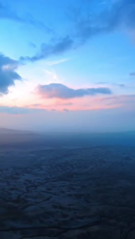 barren rocky landscape of a stunning iceland. aerial perspective on the scenery covered with haze. vertical video.