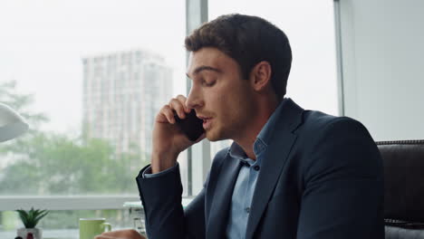 closeup mad businessman calling partner in office. annoyed customer explaining