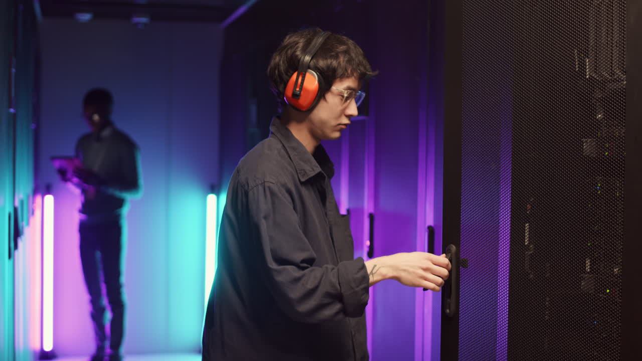 Two IT Specialists Maintaining Work of Mainframes