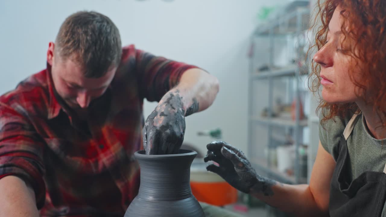 Potters Shaping Clay