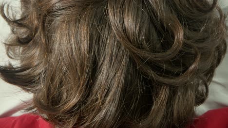 close-up of woman's brown curly hair