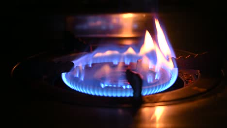 burn burner. gas is switching on, apearing blue flame gas stove video 4k