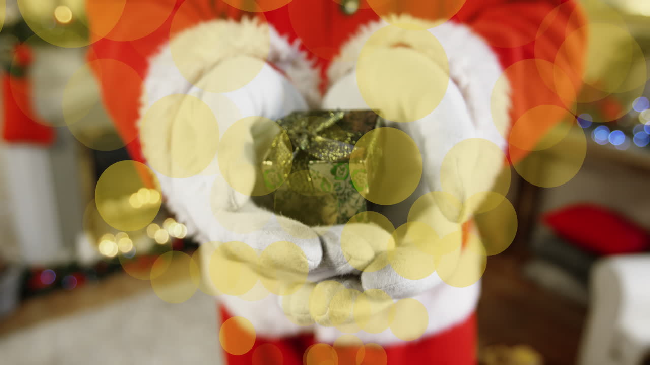 ilustración de santa con regalos y manchas amarillas animadas en negro.