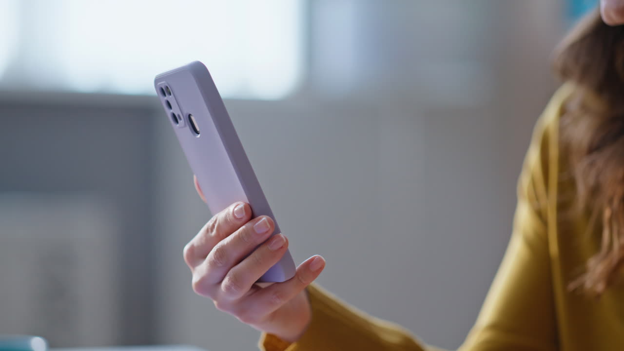 Closeup woman surfing cellphone internet at corporate workplace. Smiling lady