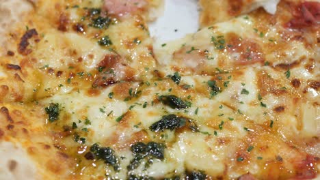 slice of cheese pizza on a plate on wooden table