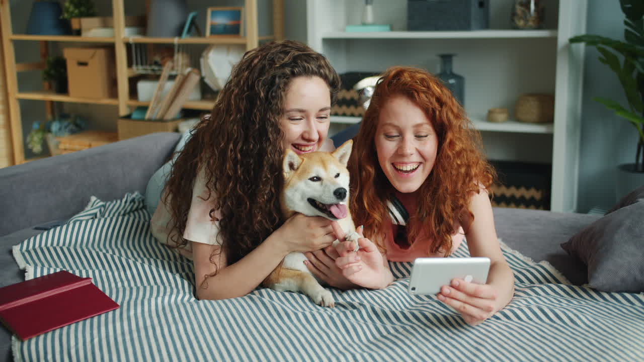 Friends Enjoying a Video Call with their Dog