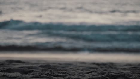 beautiful shot of waves and the sand at the beach in puerto escondido