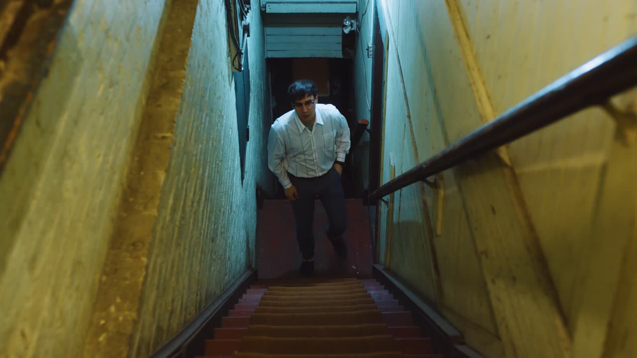 Man locks his door and leaves his apartment