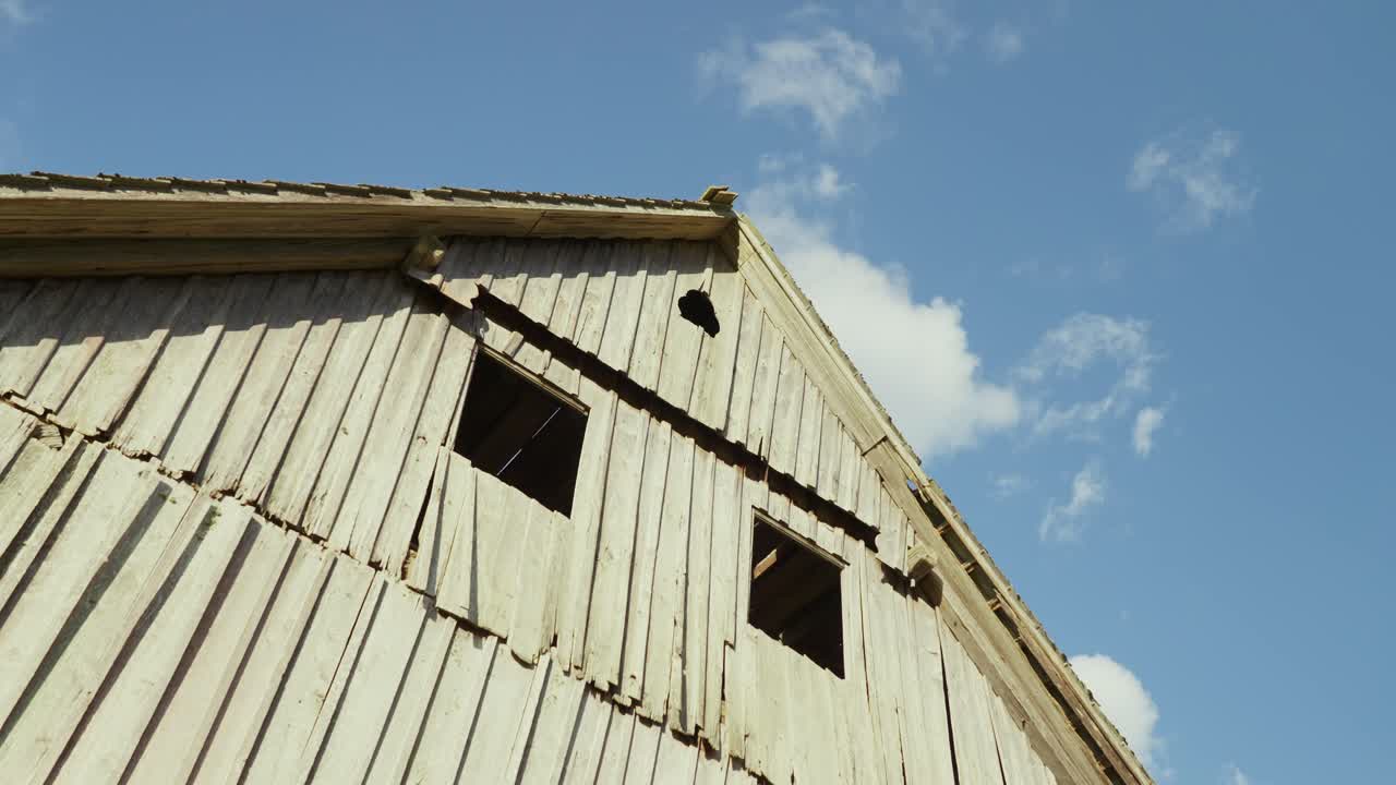 Robanov Kot farm building against a blue sky in the Robanov Planina valley Slovenia