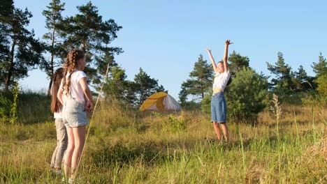girls camping in the field
