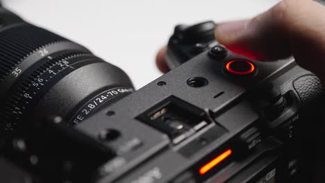detailed perspective of the record button on the sony fx3, emphasizing its importance in capturing high-quality footage