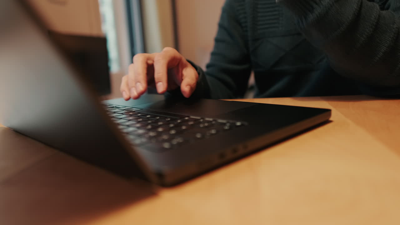 Gay Couple Working From Home on Laptop