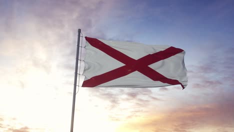 la bandera del estado de alabama ondeando en el viento. dramático fondo del cielo. 4k