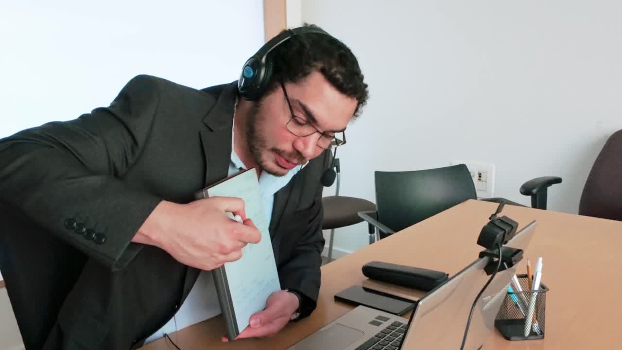 Remote Project: Man Taking Notes on Tablet