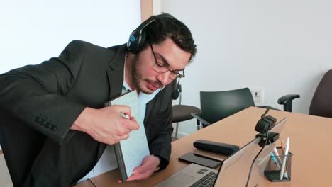 remote project: man taking notes on tablet