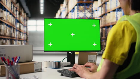 asian employee uses a isolated mockup screen on computer monitor