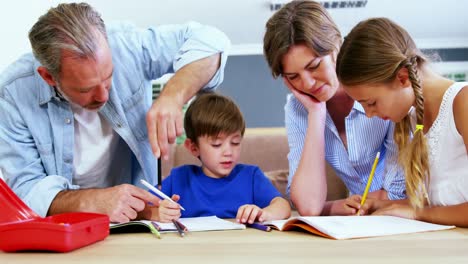 Father-and-mother-helping-children-with-homework