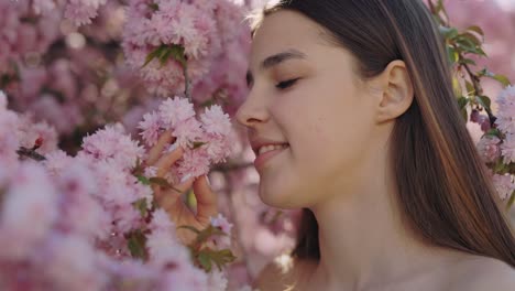 woman in a cherry blossom garden