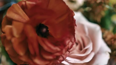 closeup on two beautiful flowers in a wedding bouquet