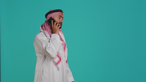 Muslim-model-answers-mobile-phone-call