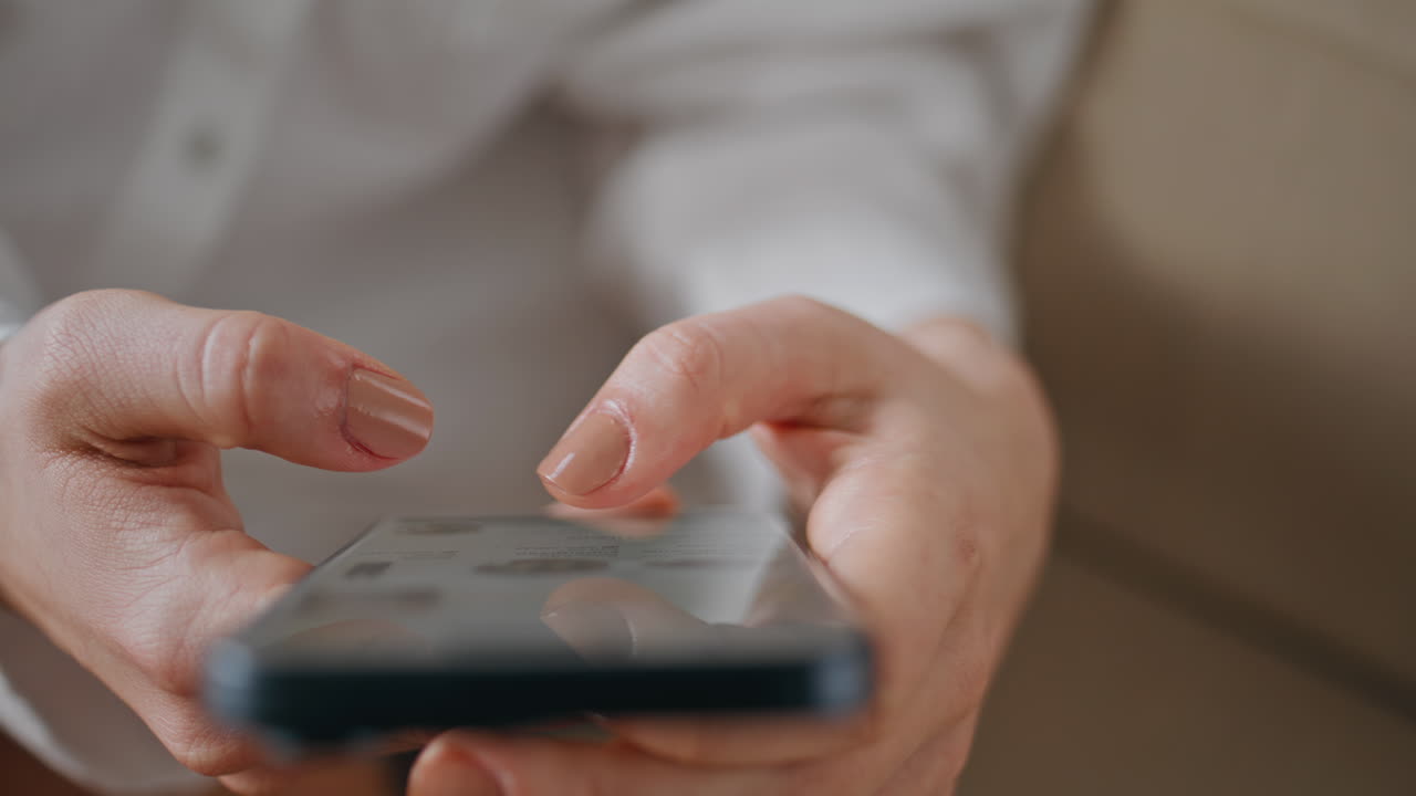 Girl hands using mobile phone browsing online shopping application closeup