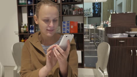 woman having coffee and chatting on the phone