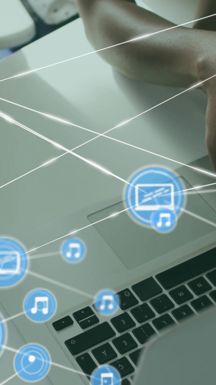 Animation of connected icons, overhead view of diverse coworkers analyzing reports on desk