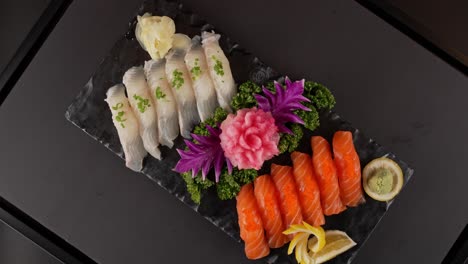 a premium platter of fresh white fish and salmon sushi, offering delicate texture and rich umami flavor. 신선한 흰살 생선과 연어 초밥이 어우러진 고급 플래터. 부드러운 식감과 감칠맛이 조화를 이룹니다.