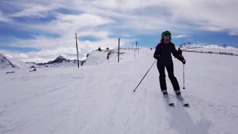 A-shot-from-the-front-following-the-descent-of-a-female-skier