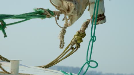 Ropes-and-rigging-with-sailing-knots-on-sailboat-deck-in-sea-breeze