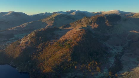 Frosty-mountains-and-wooded-hillsides-bathed-in-early-morning-sunlight