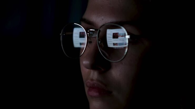 Woman Working on Computer at Night