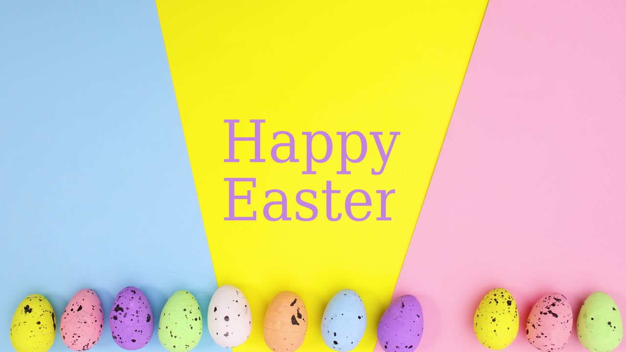 Animazione creativa in stop motion per Pasqua con uova in movimento e scritta "Buona Pasqua" su sfondo vivace.