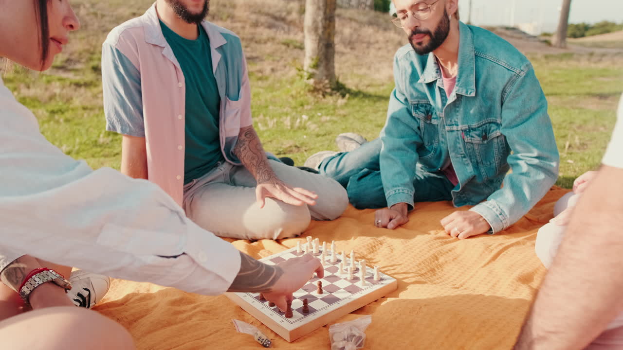 Friends Playing Chess at a Sunny Park Picnic