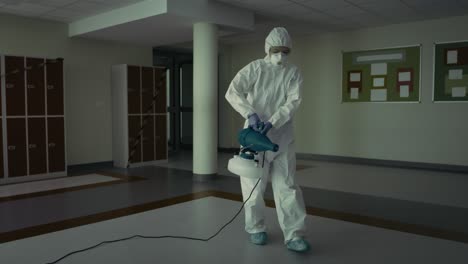 tracking video of routine disinfection of building hallway covid-19.